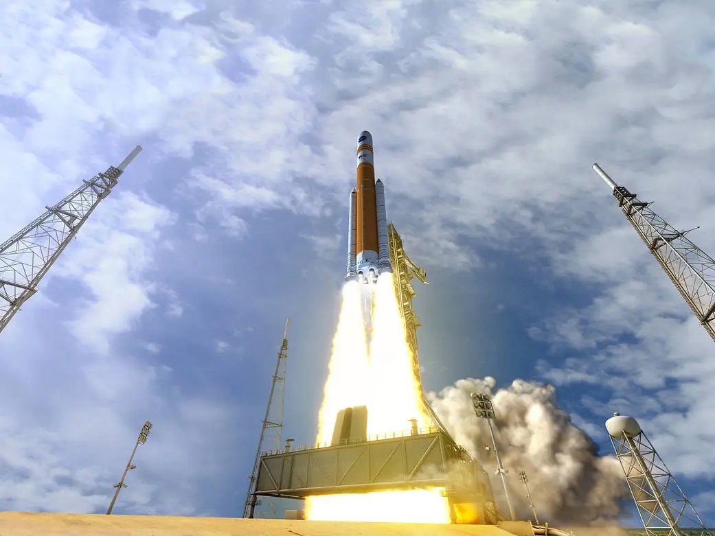 Rocket launching against a blue sky